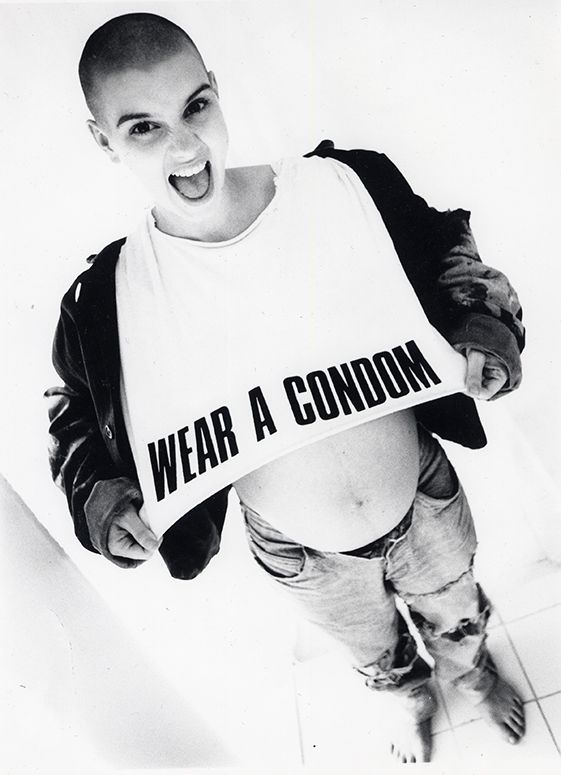 Image of the author wearing a t-shirt saying 'WEAR A CONDOM' while pregnant.